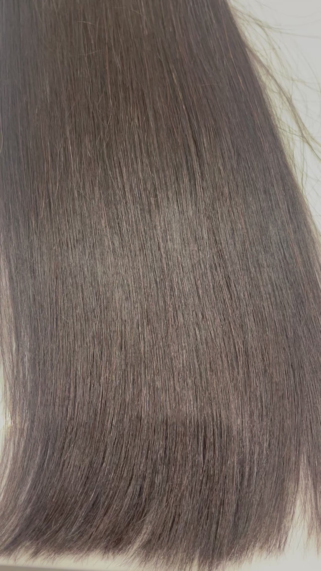 Close up of straight hair texture, showcasing glossy shine.